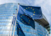 Europol Bombshell: 400,000 Gangsters? European Union flags outside modern glass building