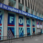Fox News building exterior with ticker and barricades