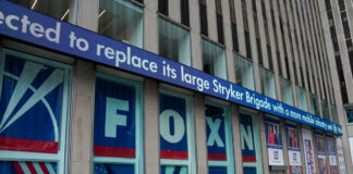 Fox News building exterior with ticker and barricades