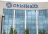 Hospital Monopoly Smacked — Prices Exposed Hands of professionals discussing documents beside a judge's gavel