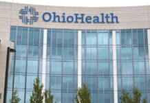 Hospital Monopoly Smacked — Prices Exposed Hands of professionals discussing documents beside a judge's gavel