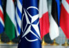 NATO flag in front of various national flags