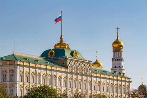 Moscow,,Russia,-,May,01,,2019:,View,Of,Grand,Kremlin The Kremlin building with the Russian flag and golden domes in the background