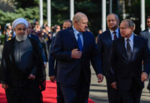 Kremlin Grip Tightens—Belarus in Play A military missile system positioned on a grassy field during sunset