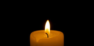 Candle flame glowing in the dark