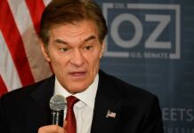 Dr. Oz Seizes Podium—Healthcare Enforcement Front and Center A man speaking into a microphone with an American flag pin on his suit