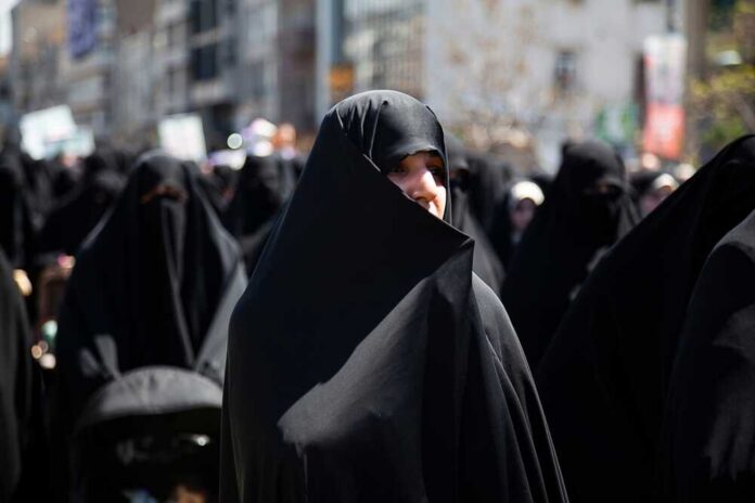 Quds,Day,March,,A,Woman,Wearing,An,Iranian,Hijab.,Iran Sign for U.S. Customs and Border Protection at an airport