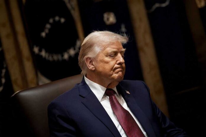 President,Donald,Trump,Announces,$12,Billion,Farm,Aid,Package,During A political figure sitting with a serious expression in a formal setting