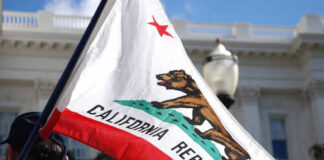 California state flag being held up at an outdoor event