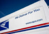 Rapper, Corrupt Postal Workers Ran $63M Mail Theft Ring USPS delivery truck with logo and slogan visible