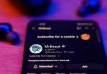 MrBeast Bets Spark Insider Uproar Phone screen showing MrBeasts YouTube channel page.