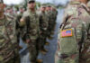 Judge TORCHES Pentagon Over Veteran Speech Military personnel standing in formation outdoors