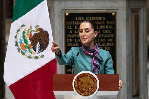 claudia-sheinbaum-pardo2530931317 Person speaking at podium with Mexican flag nearby