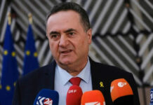Man speaking with multiple microphones in front of him