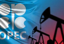 OPEC Shaken: UAE Opens the Taps OPEC logo in front of an abstract flag background with oil rigs silhouettes