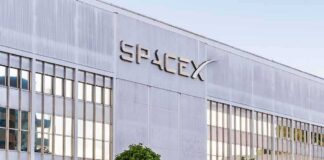 SpaceX headquarters exterior with large logo and windows