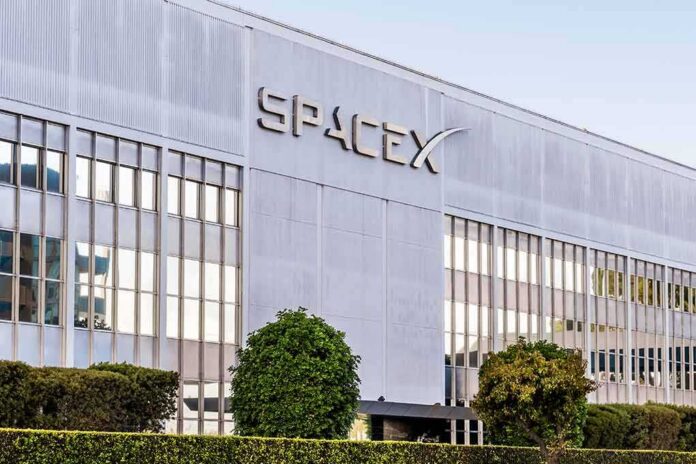SpaceX headquarters exterior with large logo and windows
