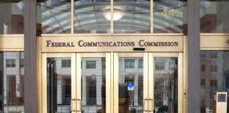 Federal Communications Commission building entrance with gold doors