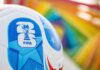 Equal Pay Twist: Men’s Winnings Divvied Up Close-up of a FIFA World Cup soccer ball with a colorful background