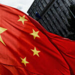 Beijing Panic: Don’t Reignite This War Close-up of the Chinese flag waving in the wind
