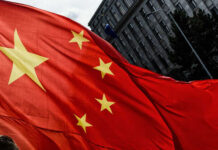 Beijing Panic: Don’t Reignite This War Close-up of the Chinese flag waving in the wind