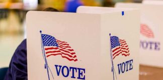 voting booth with American flag graphics