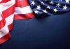 Patriotism Branded Klan? Michigan Erupts American flag fabric draped with space for copy