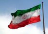 Iranian flag waving on a pole