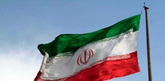 Iranian flag waving on a pole