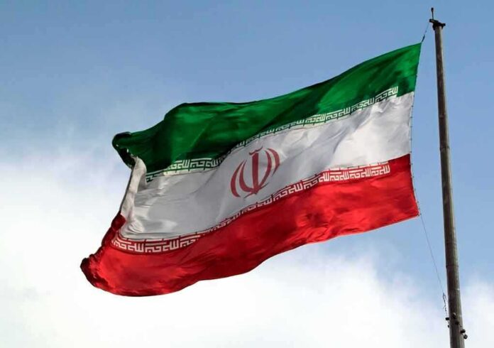 Iranian flag waving on a pole
