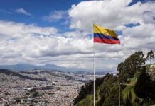 Drone War Off Ecuador? U.S. Link Alleged Ecuador flag flying over a hillside city