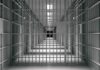 empty prison corridor with barred cells