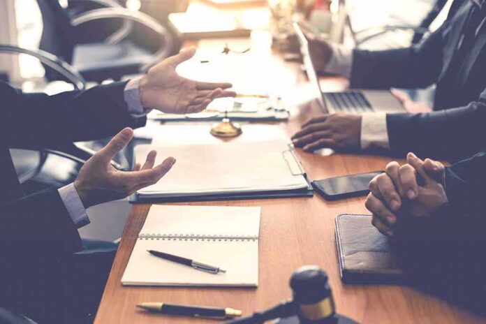 Business meeting with hands gesturing over a conference table