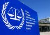 White House Moves To Cripple ICC International Criminal Court sign with scales emblem outside modern building