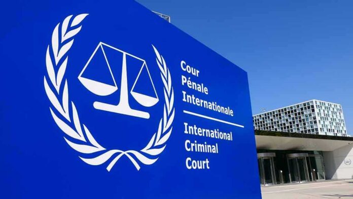 shutterstock_1383842291 International Criminal Court sign with scales emblem outside modern building