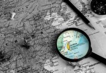 Hellscape Strategy Hits A Wall—Why Now? Magnifying glass highlighting Taiwan on a map
