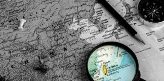 Magnifying glass highlighting Taiwan on a map