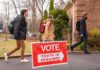 Voters walking into a polling place