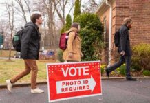 GOP Meltdown: Thune Blocks SAVE Act Gambit Voters walking into a polling place