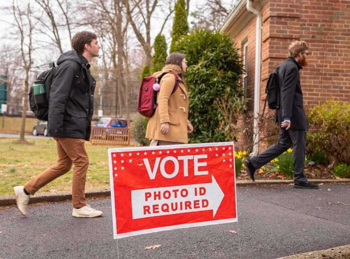 shutterstock_1662342301 Voters walking into a polling place