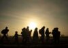 Becerra’s Vetting Gutted — Kids at Risk silhouettes of people walking at sunset