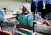 Scary Detection Gap — Virus Got A Head Start IV drip and blood pressure gauge in a hospital ward