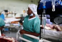 IV drip and blood pressure gauge in a hospital ward