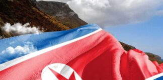 North Korea flag draped over a mountainous landscape
