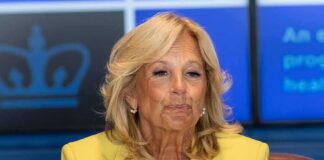 woman in yellow blazer at an event