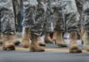 Christianity Course Lands In Military Classrooms soldiers' boots marching on a road