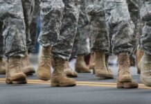 Christianity Course Lands In Military Classrooms soldiers' boots marching on a road