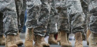 soldiers' boots marching on a road