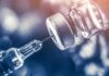 Vaccines Flashpoint Ignites Surgeon General Race syringe needle drawing liquid from a vaccine vial