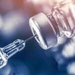 Vaccines Flashpoint Ignites Surgeon General Race syringe needle drawing liquid from a vaccine vial